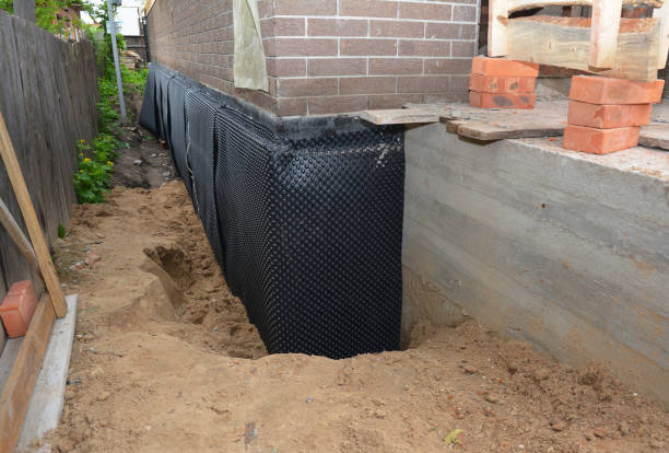Happy homeowners after waterproofing job in Kohler